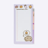 Front view of the Pusheen Magnetic Shopping List. The rectangular pad has two magnets on the back to affix the shopping list notepad to a refrigerator.