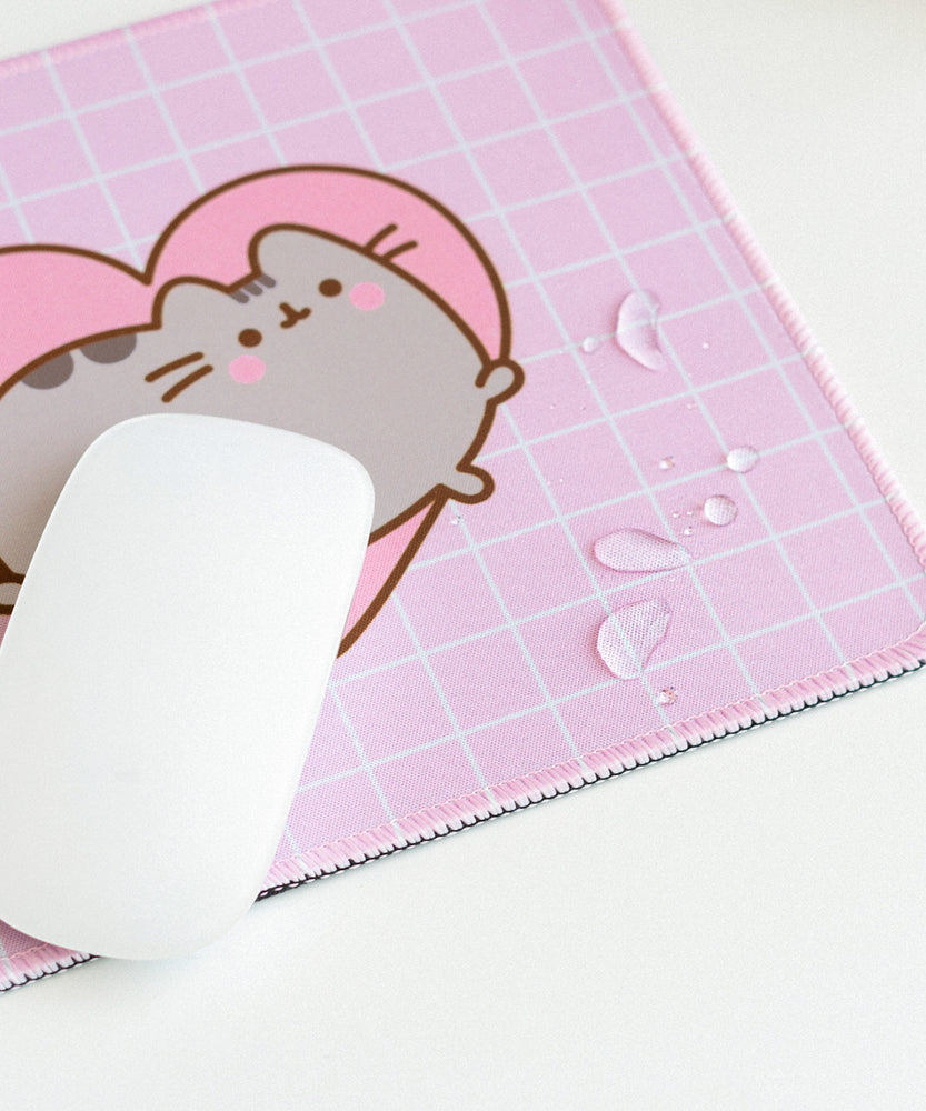 Close-up of water droplets sitting on top of the mouse pad to demonstrate the fabric's waterproof feature.