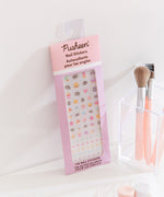 Pastel colored Pusheen nail stickers. The sticker set includes ice cream, cupcake, pizza, stars, and more decals. 