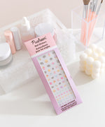 Back view of the packaging holding the Pusheen Nail Stickers. On the back is directions for how to apply and remove the stickers. 