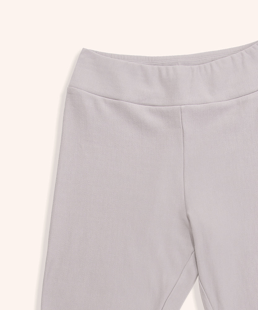 Close-up view of the Pusheen legging’s wide waistband. The taupe-colored loungewear bottoms have a thick band at the top for a comfortable fit.  