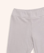 Close-up view of the Pusheen legging’s wide waistband. The taupe-colored loungewear bottoms have a thick band at the top for a comfortable fit.  