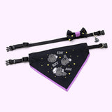 Pusheen pet Halloween-themed collar and bandana set laid out to show the length of the collars and the size of the printed bowtie and bandana. The set rests on a light purple background. 