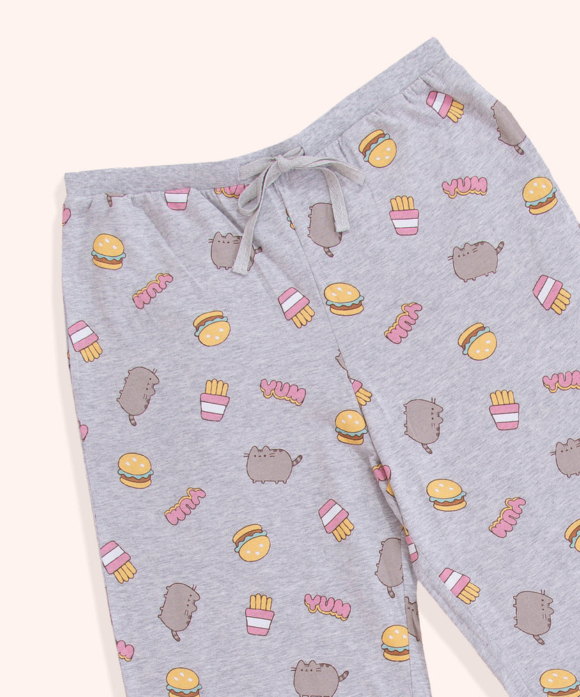 A close-up view of the grey adjustable drawstring on the Pusheen pajama pants. The light grey adjustable ribbon sits in a thin, stretchy waistband.  
