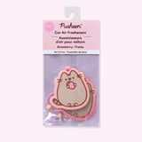 Pusheen car air fresheners 2-pack in their packaging bag. The strawberry car fresheners are held within a clear, pink and purple bag.