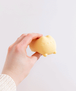 Side and back view of the Pusheen Surprise Squishy Toy Assormtnet. Pusheen's striped tail is engraved at the back of the toy.