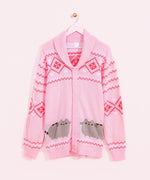 Pink knit cardigan hangs on a pink hanger in front of a light pink wall. The unisex cardigan features Pusheen the Cat in grey and brown surrounded by dark pink diamond pattern and white hearts and diamond pattern all over the sleeves and top of button up cardigan. 