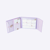 Interior of the purple Pusheen Weekly Planner Binder. Inside the binder is an envelope slot, square sticky notes, small rectangular sticky notes, a notepad, and a week-at-a-glance calendar for planning. 