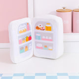Interior view of the fridge plush. The plush opens to reveal a printed stocked fridge of Pusheen's favorite snacks. Included in the interior prink are cakes, donuts, fruits, eggs, and more!