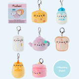 Pusheen the Cat has taken the form of seven miniature kitchen-inspired plushes. At the top left is the packaging box for the Pusheen’s Kitchen surprise plush. From left to right and top to bottom, the surprise plush are a cheese wedge, white milk jug, rectangular refrigerator, purple tea pot, white bead slice, honey jar, and a cooking pot. The bottom right corner has a circle with the words “1 Mystery Design” indicating eight possible miniature plush keychains are available. 