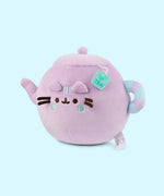 Side quarter view of the Teapot Squisheen. Pusheen's facial features are embroidered on the front of the plush and her blush and three stripes in between her ears are embroidered in a light mint green color.