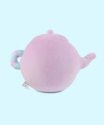 Back view of the Pusheen's Kitchen Teapot Squisheen Plush. Looking at the back, the lilac colored tea kettle lid and pour spout can be seen as well as the mint green and lilac striped handle extending off the round plush body.