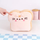 Front view of the Pusheen's Kitchen White Bread Squisheen Plush. The white bread loaf plush features Pusheen as a slice of bread with rounded top corners and a square bottom.