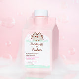 The Creme Shop x Pusheen Strawberry Gummy Bubble Bath in front of a light pink background with white suds. The pink pour top packaging mentions that the bubble bath contains argan oil and aloe vera and is apart of The Creme Shop's Klean Beauty collection.