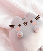 Back view of the plush shows Pusheen’s classic grey head and back stripes and striped grey tail.