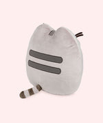Back view of the plush shows Pusheen’s classic grey head and back stripes and striped grey tail.
