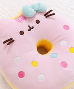 Close-up view of the Pusheen side of the pink and white donut plush. This photo showcases the pastel embroidered sprinkles and Pusheen’s stripes.  
