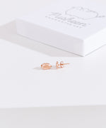 Front and side view of the Pusheen Lazy Stud Earrings in rose gold vermeil. One earring faces forward while the other faces the side to showcase the earring bar and backer mechanism.  
