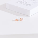 Front and side view of the Pusheen Lazy Stud Earrings in rose gold vermeil. One earring faces forward while the other faces the side to showcase the earring bar and backer mechanism.  
