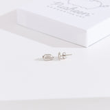 Front and side view of the Pusheen Lazy Stud Earrings in sterling silver. One earring faces forward while the other faces the side to showcase the earring bar and backer mechanism. 