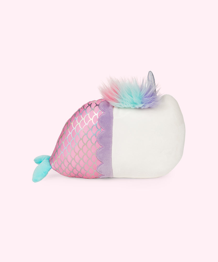 Back view of the Magical Lights Mermaid Pusheenicorn Plush in a light pink space. The fluffy mane starts around the unicorn horn and ends right at the start of the tail, making it look like a fuzzy caterpillar. There are no additional details on the back of the plush. 