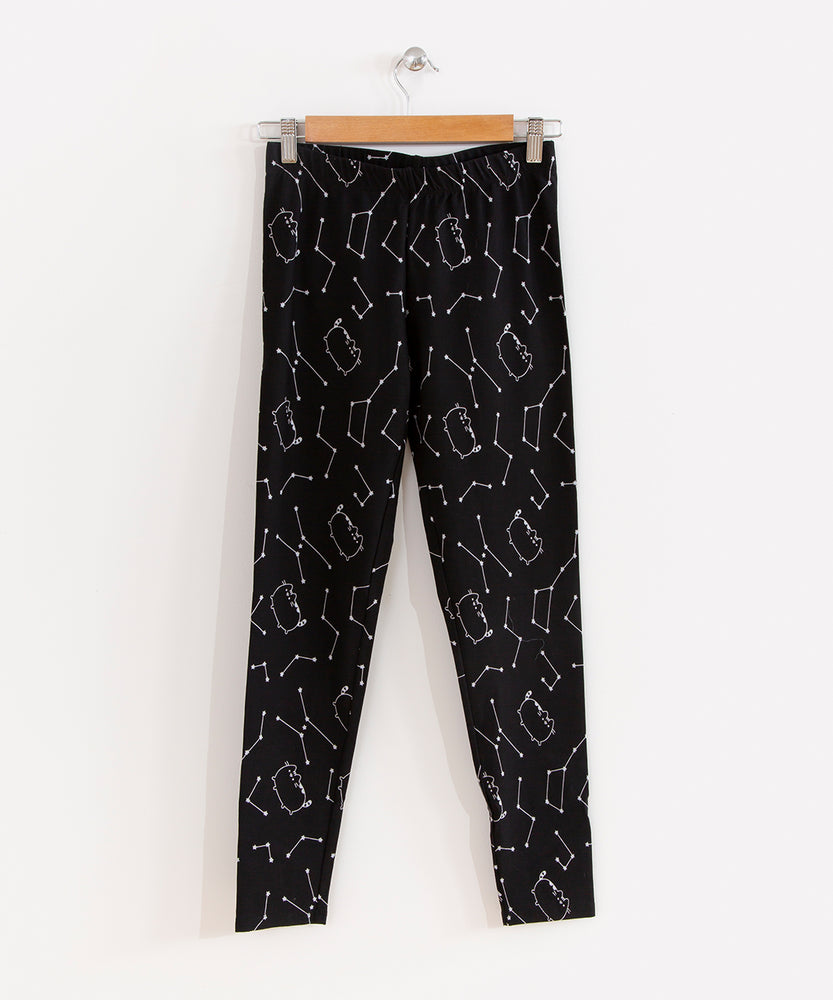 The Pusheen Celestial Leggings hanging from a wooden hanger in front of a white background.