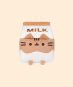 Front view of the Chocolate Milk Sips Plush in front of a yellow background. 