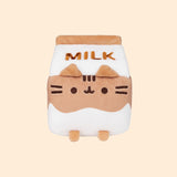 Front view of the Chocolate Milk Sips Plush in front of a yellow background. 