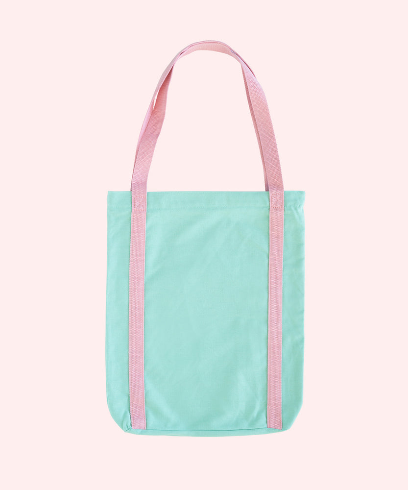 Back view of Pusheen Deluxe Tote Bag. The mint tote bag has pink handles that extend down the entire body of the bag. 