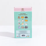 The back of the Pusheen I love Kitties Plush Collectors Set in its original packaging, standing upright in front of a white background. The back features the original comic the plush set is based on, with four rows of three miscellaneous cats, starting with Pusheen holding a pizza and ending with a skunk, which the cats around it react to its smell. The copyright information is noted in small text in a block underneath the comic.