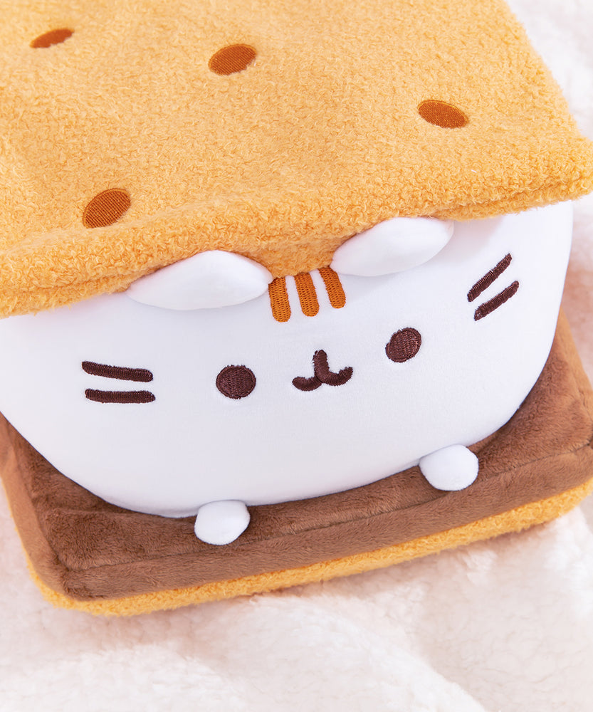 Top right quarter view of S'mores Squisheen. The top graham cracker inspired plush features five dots that resemble the holes found in real graham crackers.