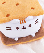 Top right quarter view of S'mores Squisheen. The top graham cracker inspired plush features five dots that resemble the holes found in real graham crackers.