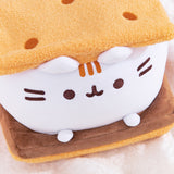 Top right quarter view of S'mores Squisheen. The top graham cracker inspired plush features five dots that resemble the holes found in real graham crackers.