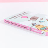 The Pusheen book lying on top of white surface to show off the pink book spine with Pusheen floating using a balloon.