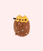 Back view of the plush shows Pusheen’s classic lines ar her back with her striped tail that is yellow and brown on this Chocolate Dipped Cookie Squisheen. 