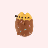 Left quarter view of cookie inspired plush. This view shows Pusheen’s feet extending slightly off her body. 