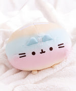 Close-up of the embroidered Pusheen face detail. The embroidered thread is a brown color.  In between the ears of the plush are three, white embroidered stripes.  