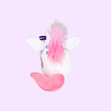 Side view of the Super Pusheenicorn Squisheen. Pusheen’s fluffy mane goes down from her ears and over her back purple stripes. Super Pusheenicorn has one plush wing on the front and the back.
