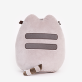 Back view of the Pizza Pusheen Plush in front of a white background. Pusheen’s back has the standard two back stripes and a striped tail. Pusheen’s whiskers stick out partially from the other side.