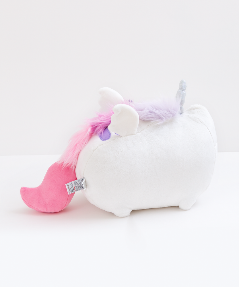 Back view of the Super Musical Pusheenicorn Plush in front of a white background. The sparkly horn, the man, the wings, part of the 2nd back stripe, the plush tail and the plush tag are all visible from the back. 