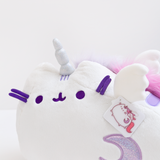 Close up of Super Pusheenicorn’s face. There are three light purple head stripes in between Super Pusheenicorn’s ears, emerging from her sparkly silver horn.