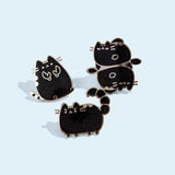 Group photo of three of the metallic Pusheen horoscope pins, featuring Pusheen as the three horoscope signs, Cancer, Scorpio, and Pisces.